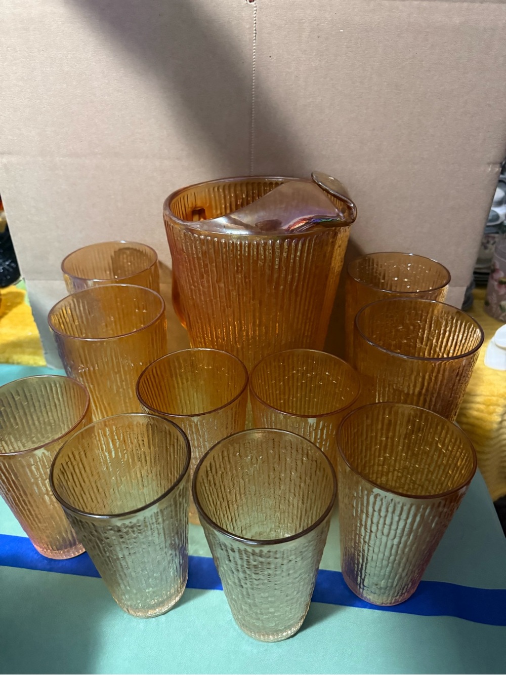 Carnival glass pitcher with 10 glasses